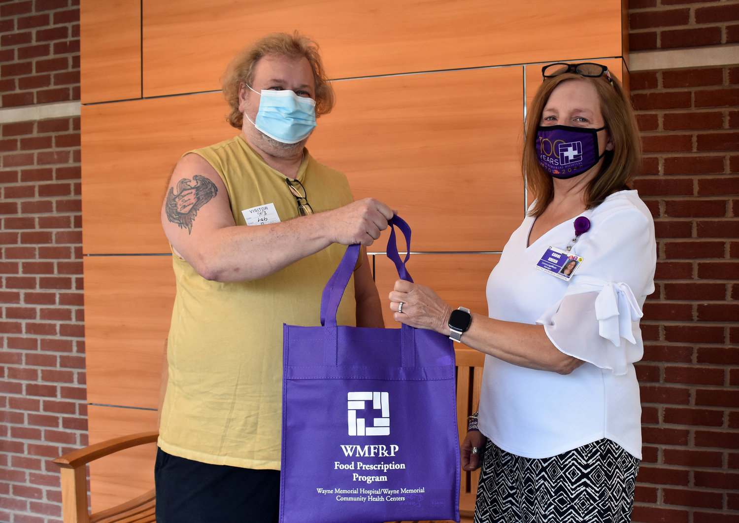 Wayne Memorial's food prescription program was funded after feedback was received from a 2019 survey. Pictured are George Barton, left, and Carol Kneier.